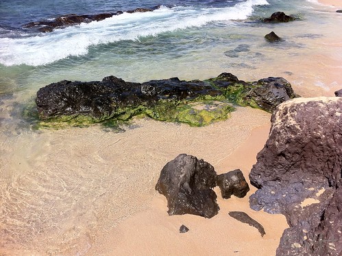 Sand, surf and lava rocks