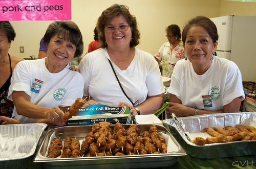 Happy vendors at a Filipino food booth at Kona Coffee Festival